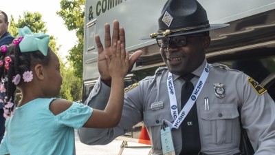 trooper greets child at event